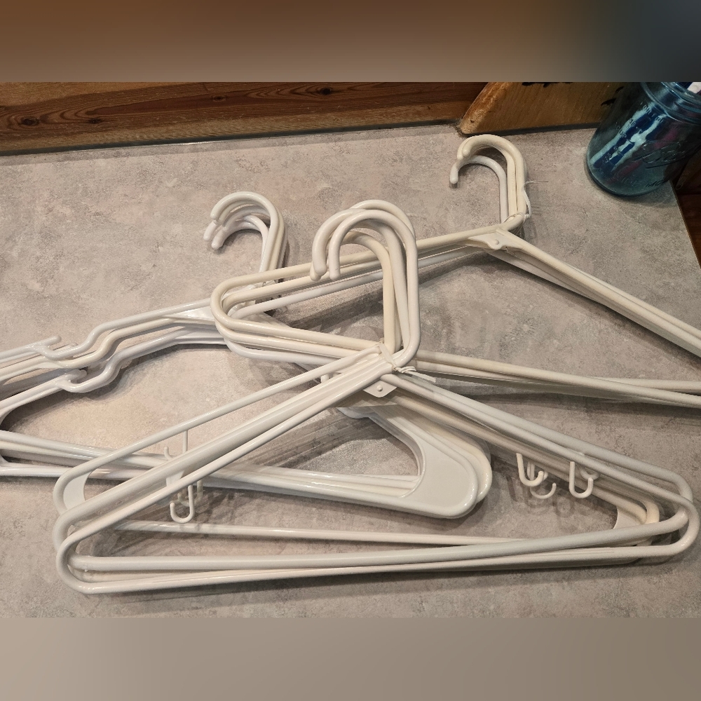 White plastic clothes hangers. 16, great condition.